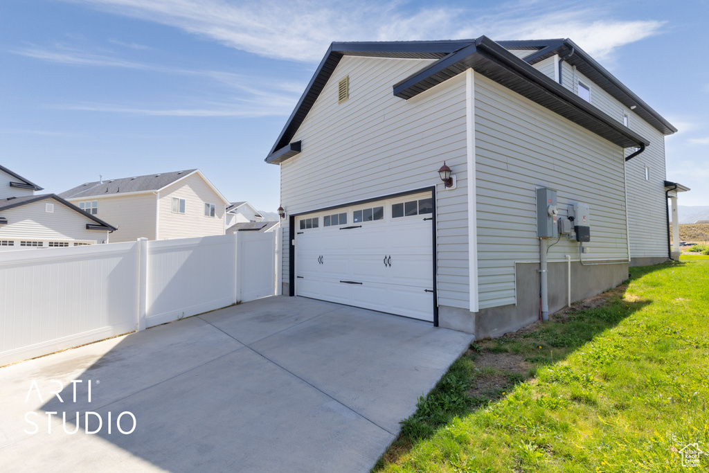 View of home's exterior featuring driveway