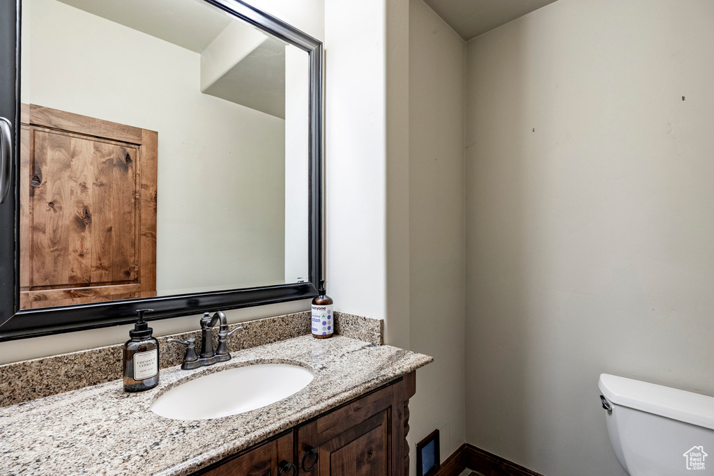 Bathroom with vanity and toilet