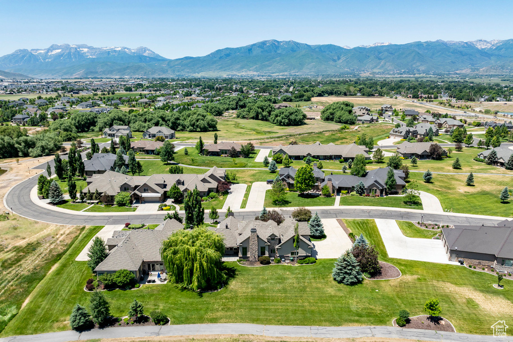 Aerial view of residential area with a mountainous background