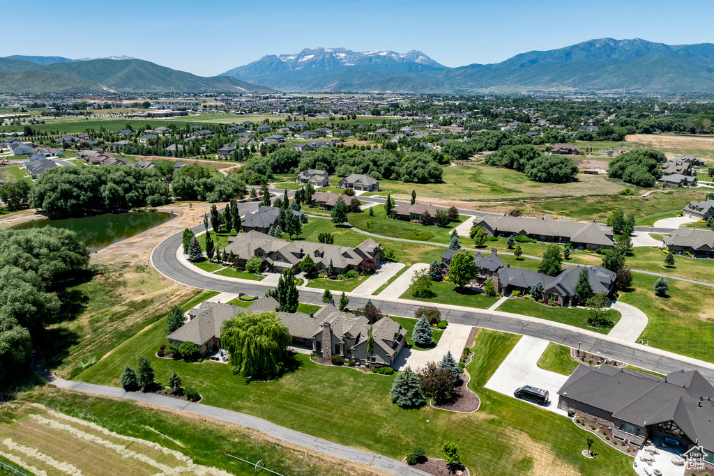 Aerial perspective of suburban area with a mountainous background