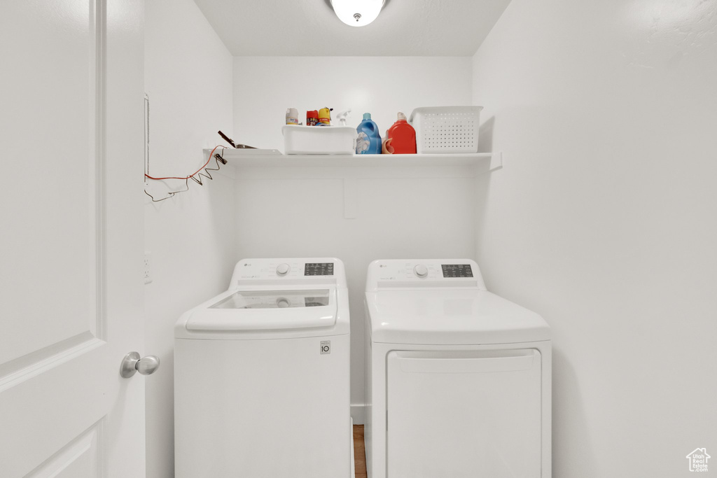 Laundry room featuring separate washer and dryer