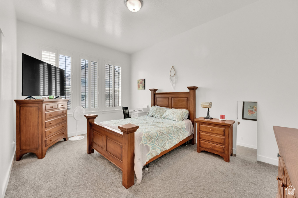 Bedroom with light carpet