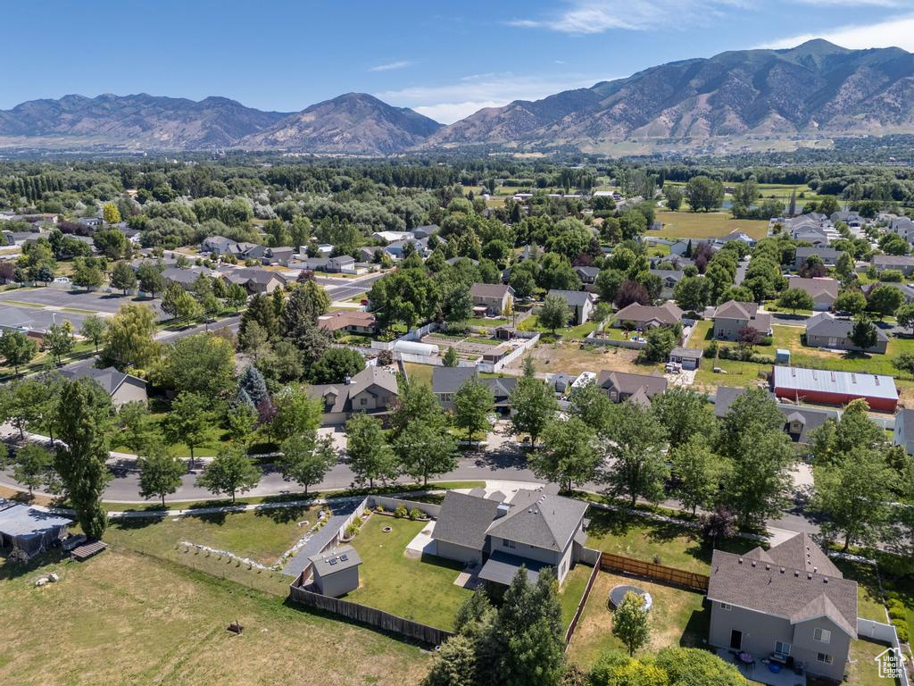 Aerial view of residential area featuring mountains