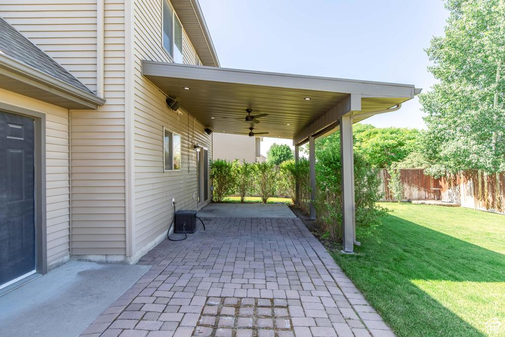View of patio with a ceiling fan