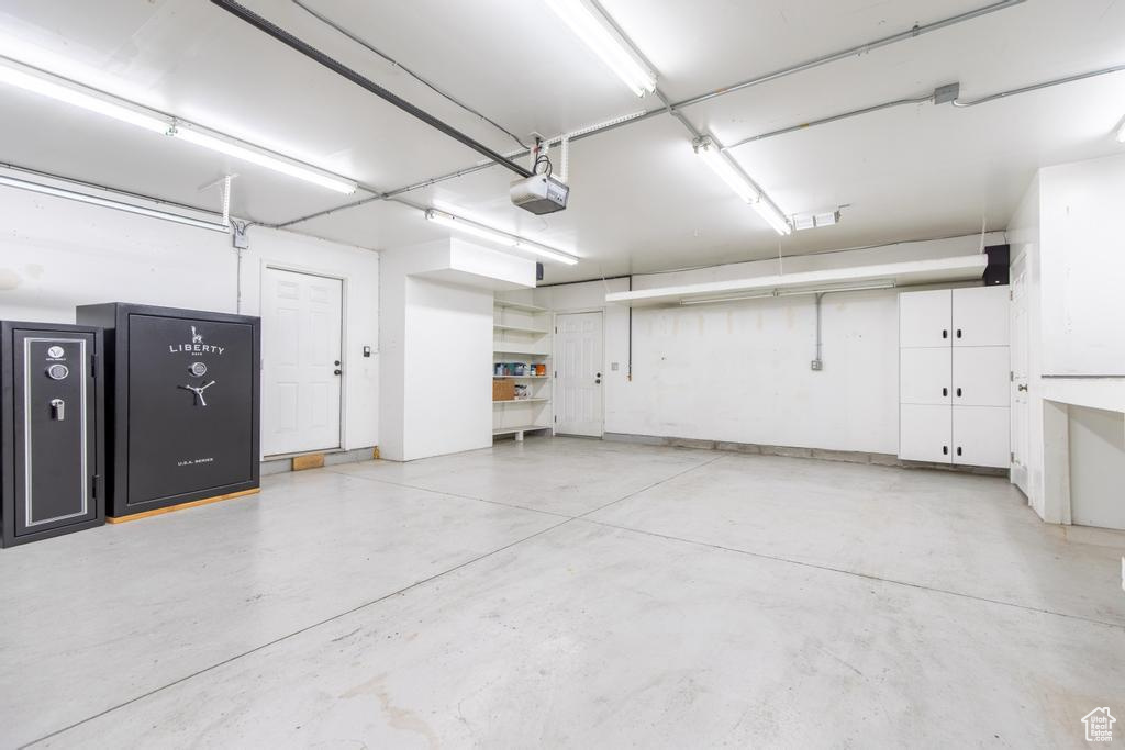 Garage featuring a garage door opener
