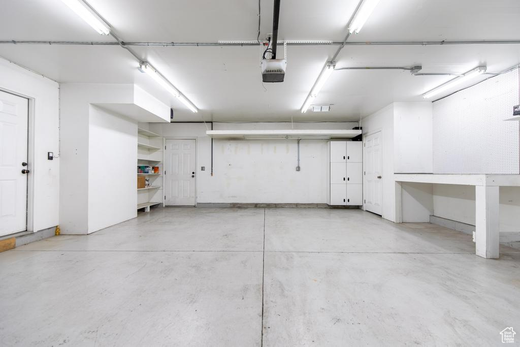 Garage featuring a garage door opener