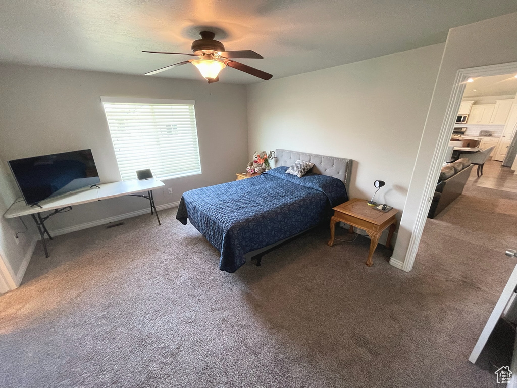 Bedroom featuring carpet flooring and ceiling fan