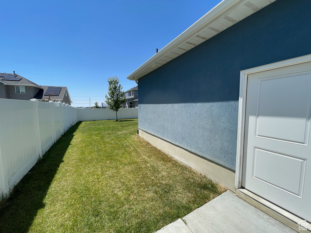 View of fenced backyard