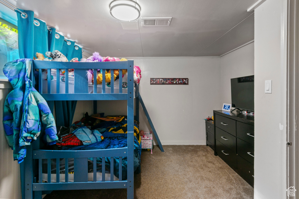 Bedroom with carpet and baseboards