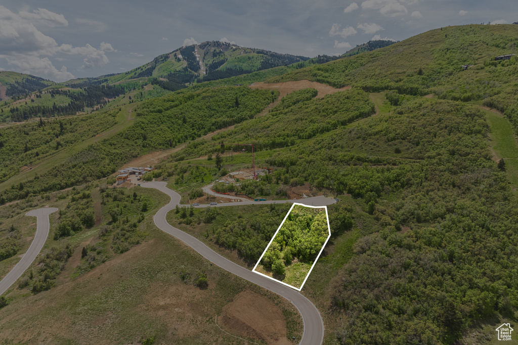 Aerial view of property\'s location featuring mountains and property parcel outlined