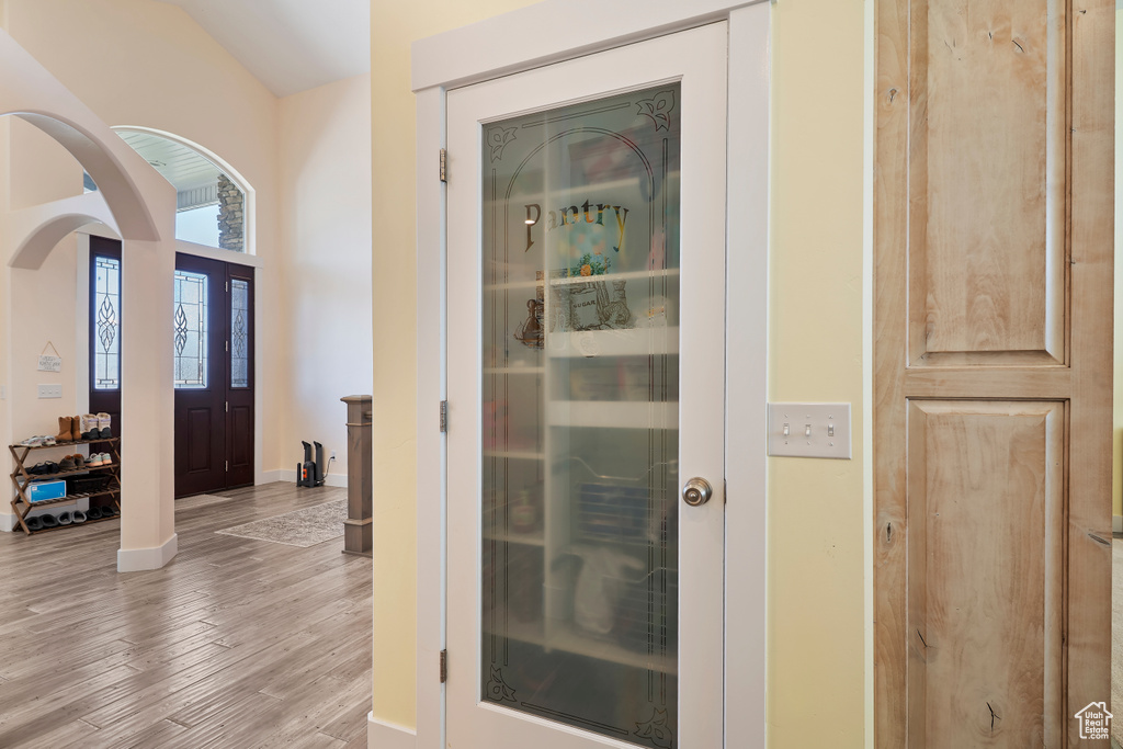 Detailed view of wood finished floors and arched walkways