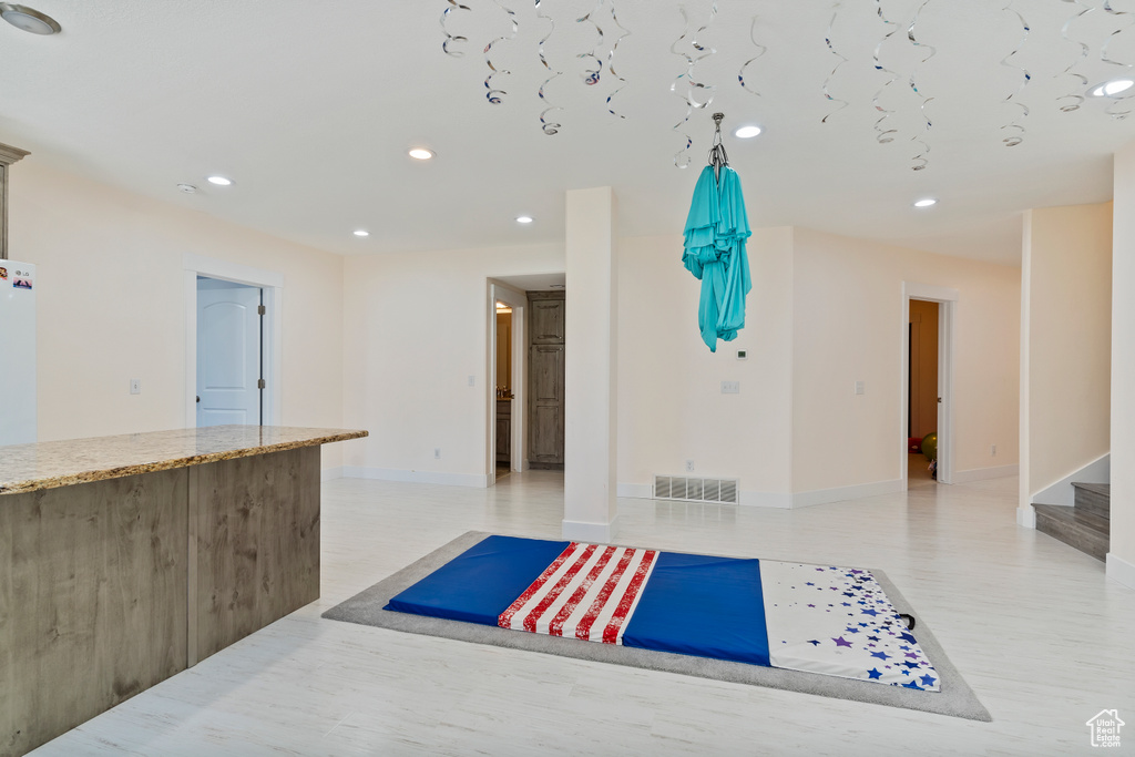 Exercise area featuring recessed lighting and baseboards