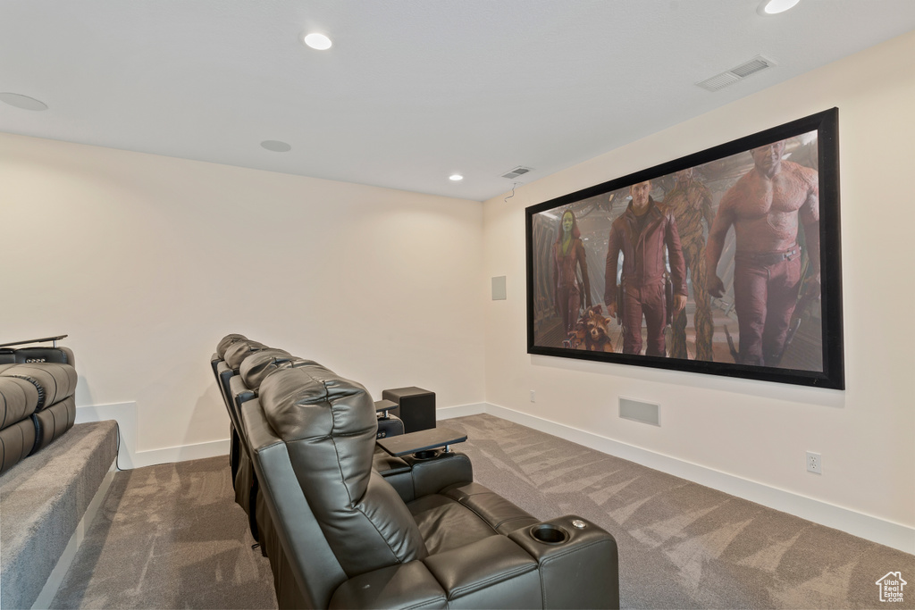 Cinema room featuring carpet floors and recessed lighting