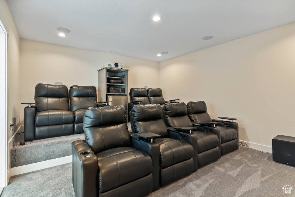 Cinema with carpet floors and recessed lighting