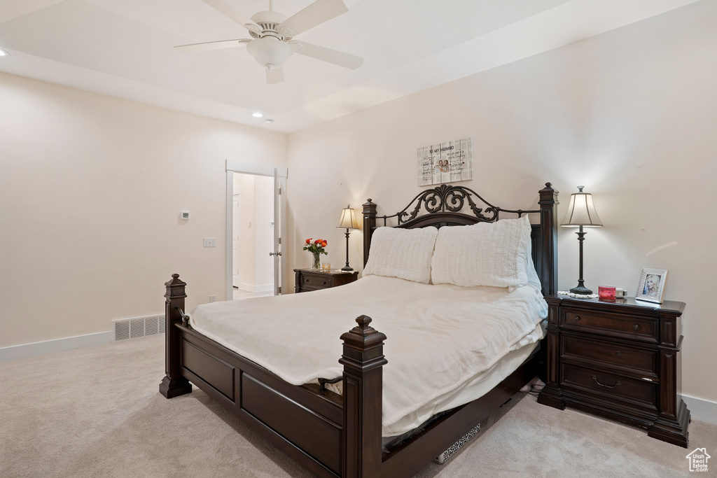 Bedroom with light carpet, recessed lighting, and ceiling fan