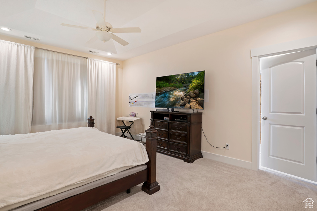 Bedroom featuring light colored carpet, recessed lighting, and ceiling fan