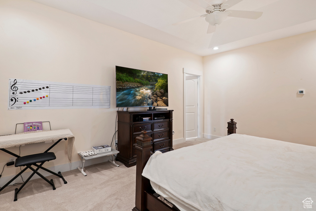 Bedroom featuring light colored carpet, recessed lighting, and a ceiling fan