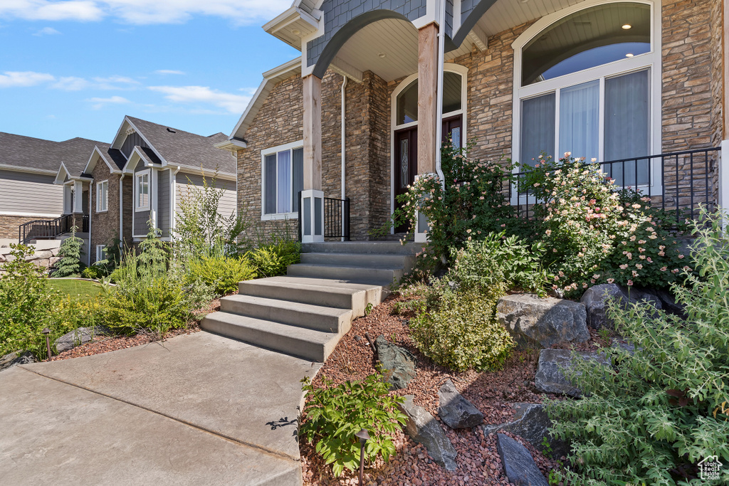 Entrance to property with stone siding