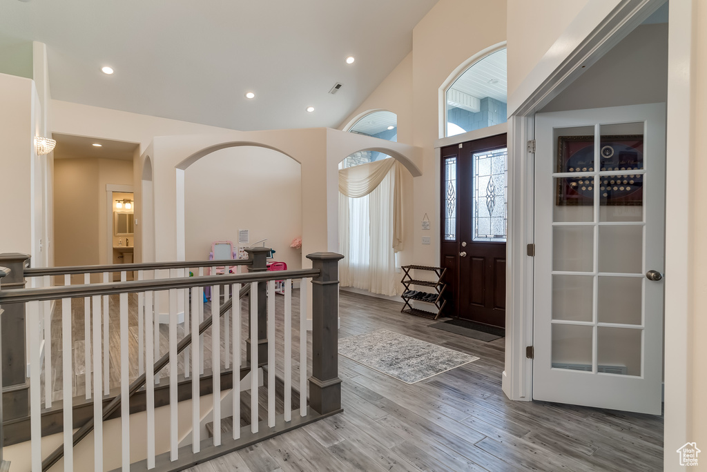 Foyer entrance featuring wood finished floors and recessed lighting