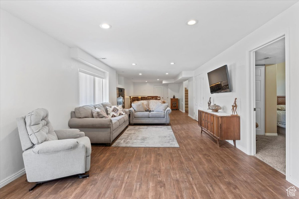 Living room featuring wood finished floors and recessed lighting