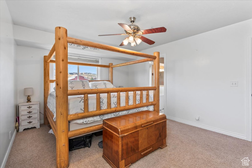 Bedroom with carpet floors and a ceiling fan