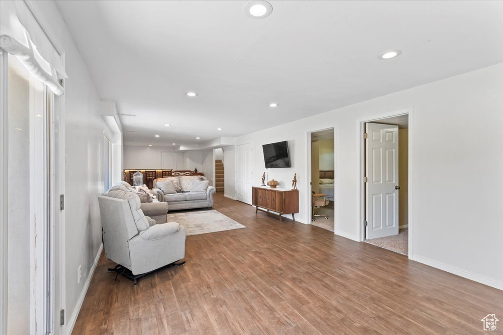 Living area featuring wood finished floors and recessed lighting