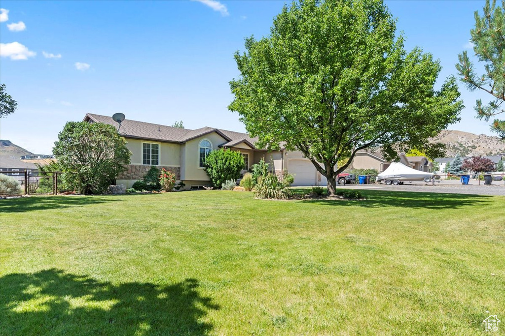 View of yard with an attached garage