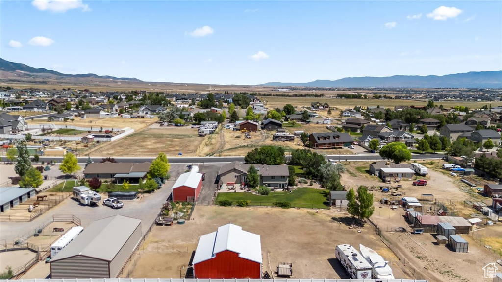 Aerial perspective of suburban area with a mountainous background