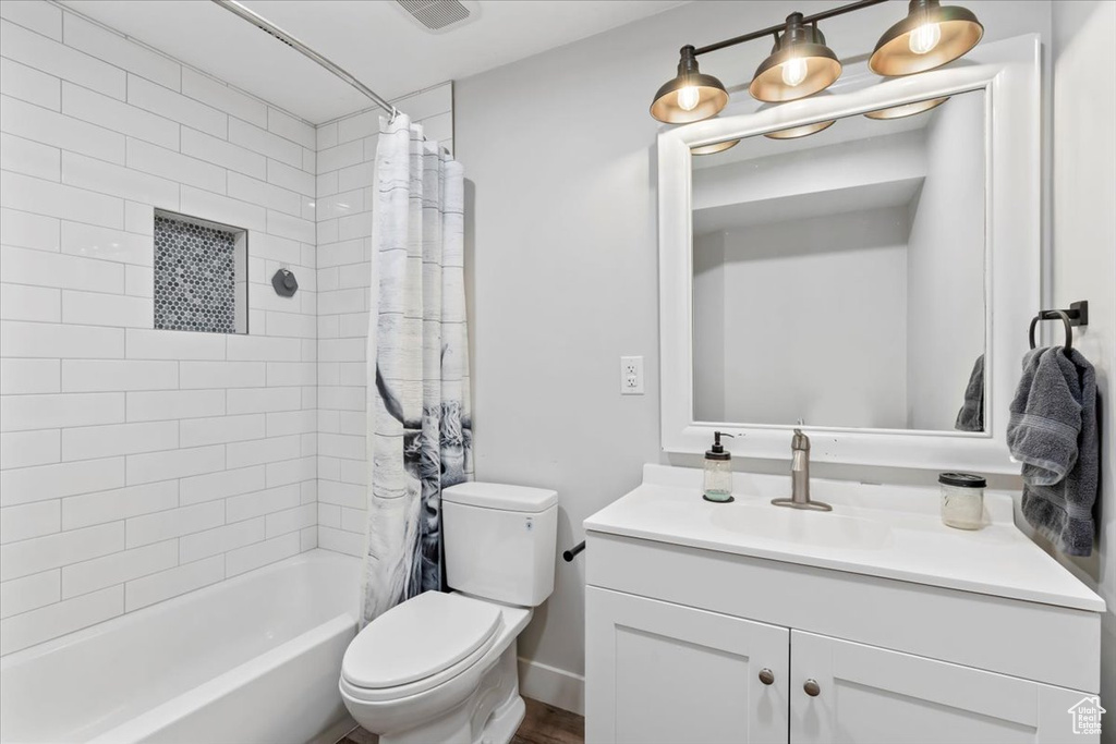 Full bathroom featuring vanity and shower / bath combo