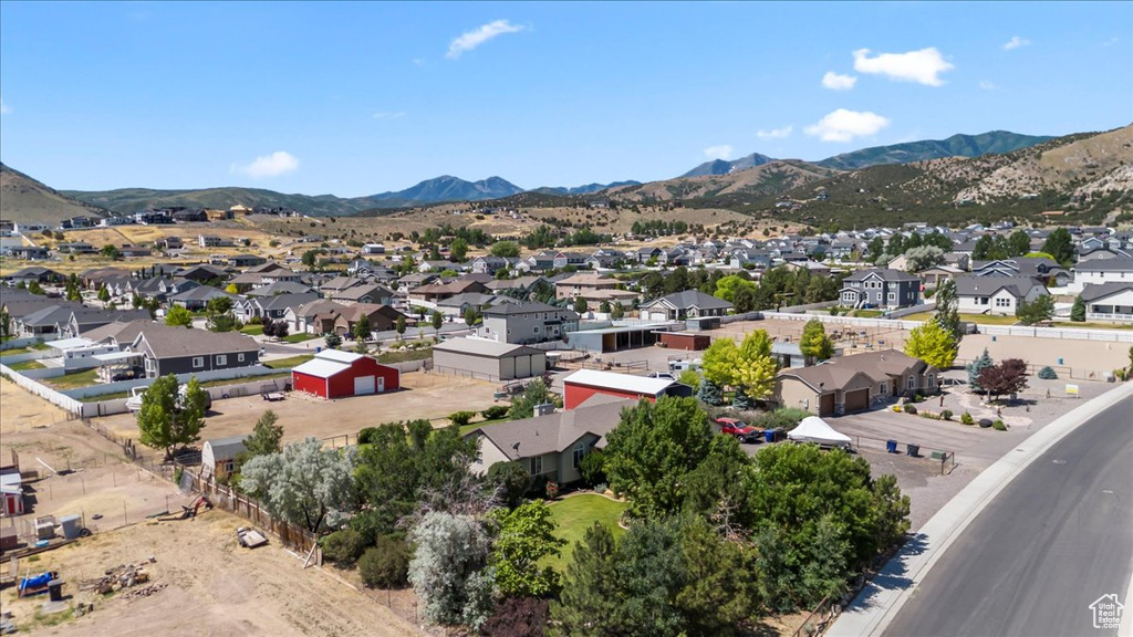 Aerial view of residential area featuring a mountainous background