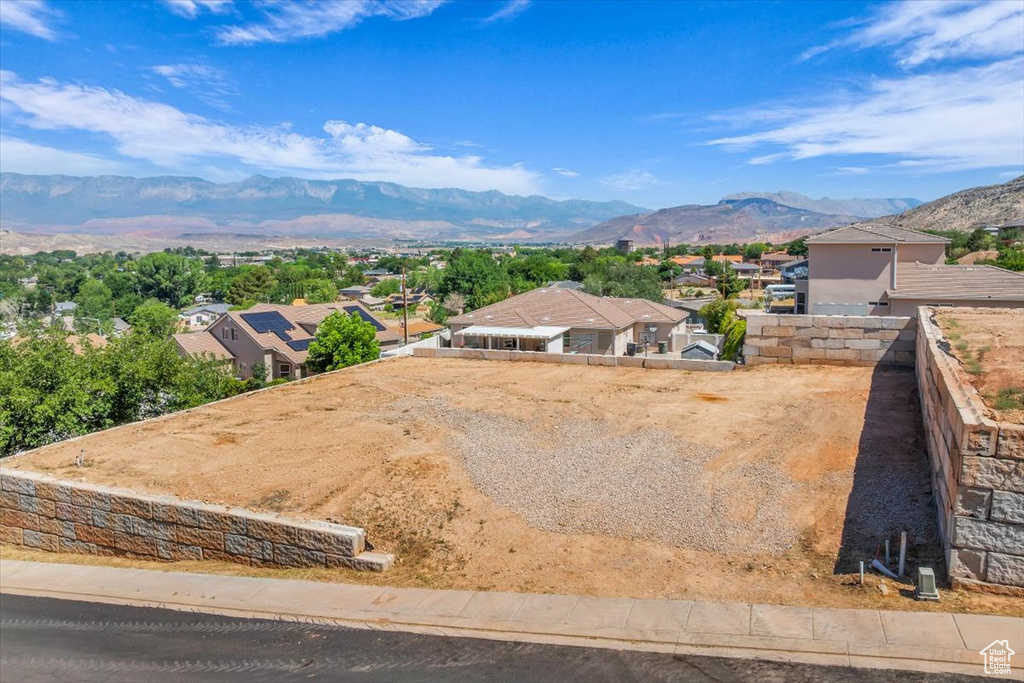 Aerial perspective of suburban area with a mountain backdrop