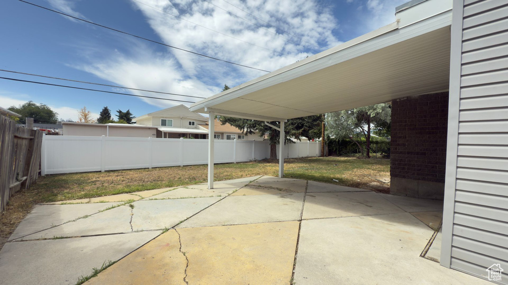 Fenced backyard featuring a patio