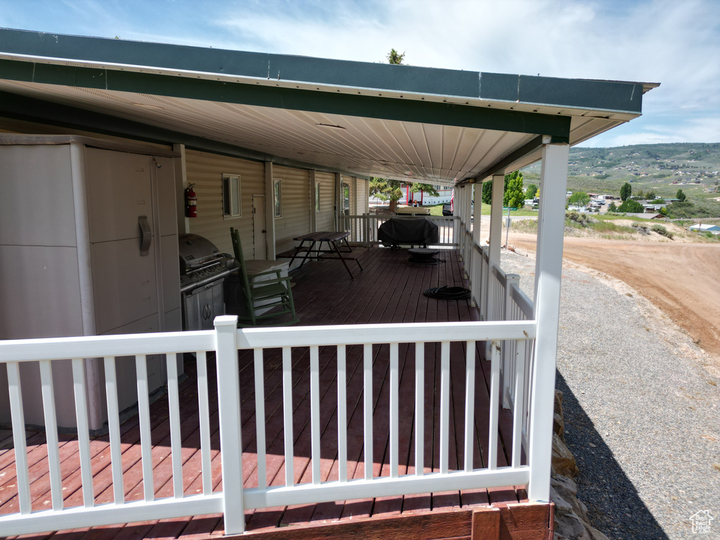 Wooden deck featuring grilling area