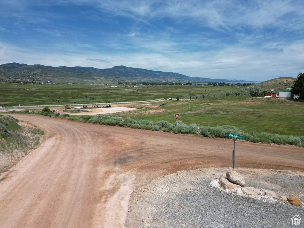 View of mountain background featuring rural landscape