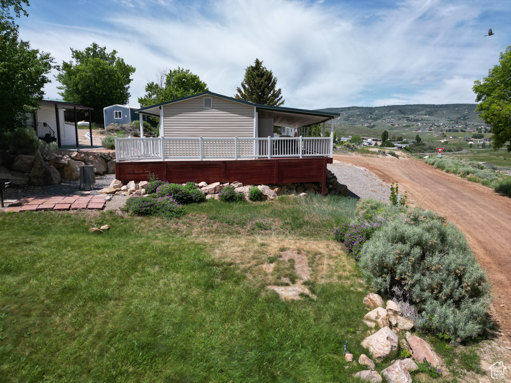 Back of property with a wooden deck