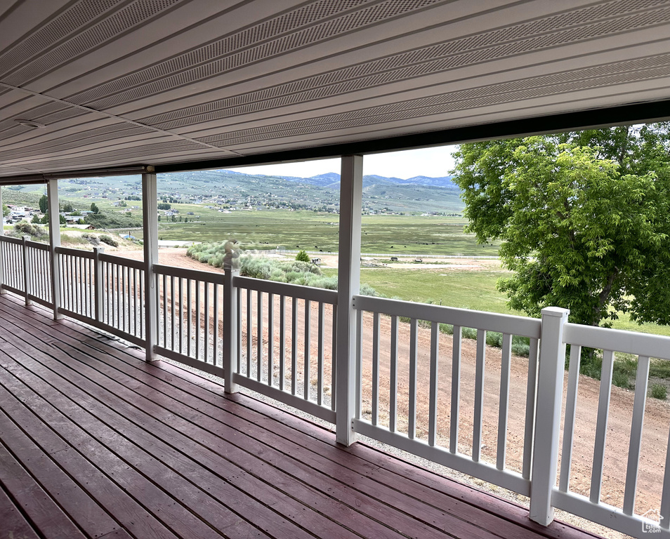 Wooden deck featuring a mountain view