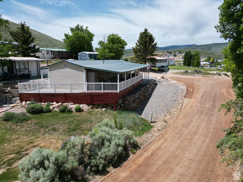 Rear view of house featuring a mountain view