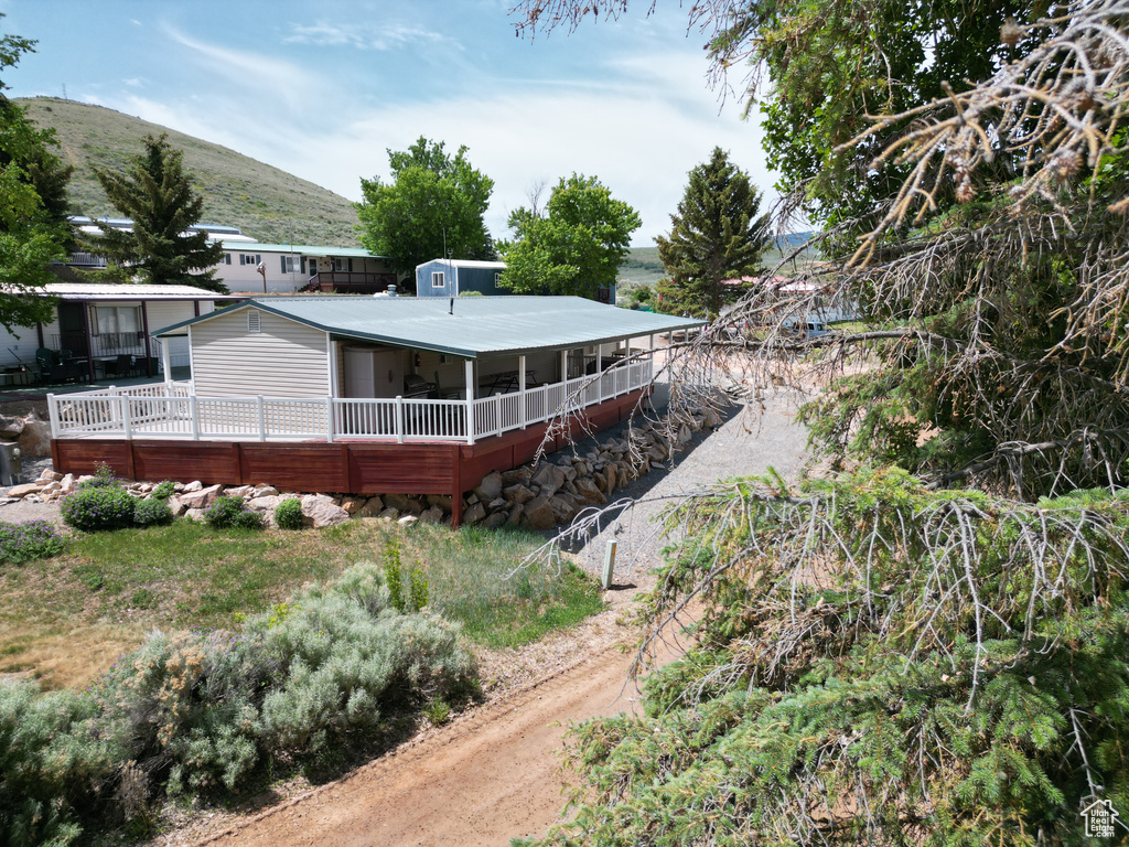 Rear view of property with a mountain view