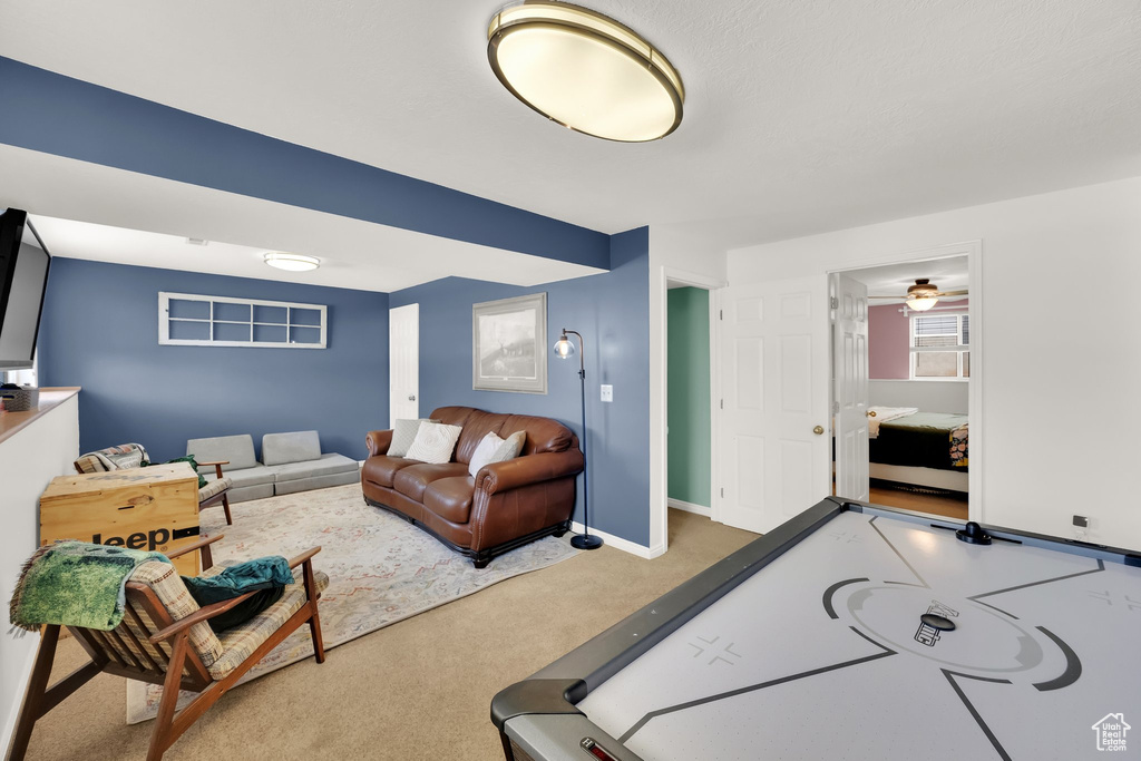 Playroom featuring carpet floors and a ceiling fan