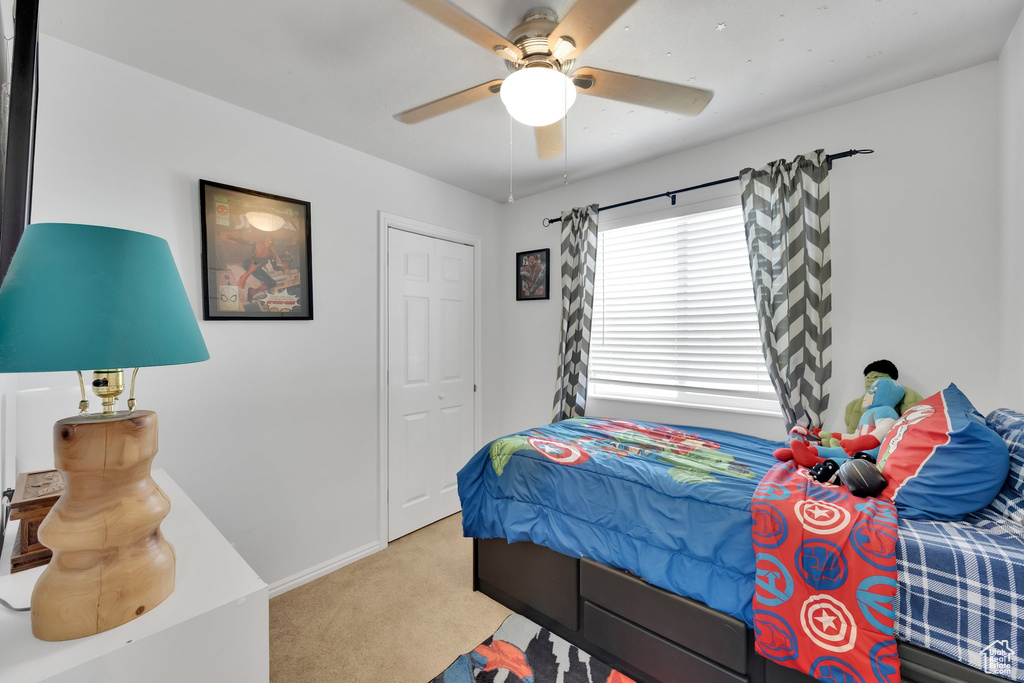 Bedroom with carpet floors and ceiling fan