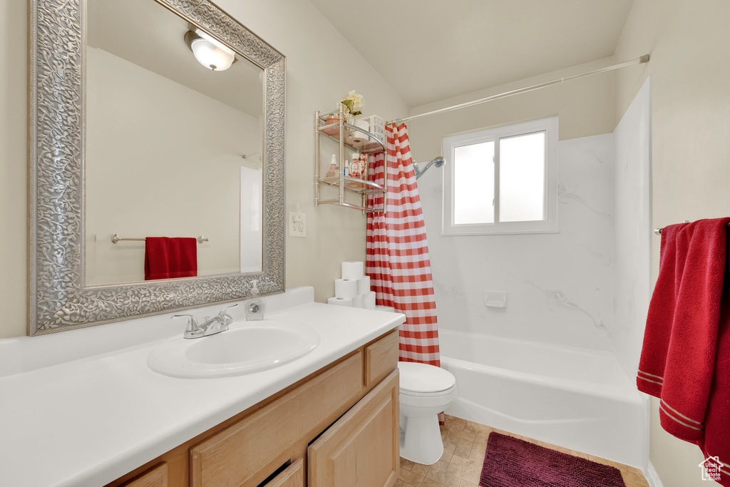 Full bath with vanity and shower / bath combination with curtain