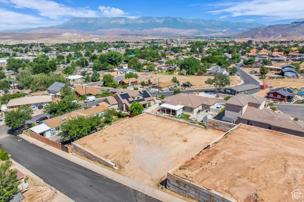 Aerial perspective of suburban area featuring a mountain backdrop