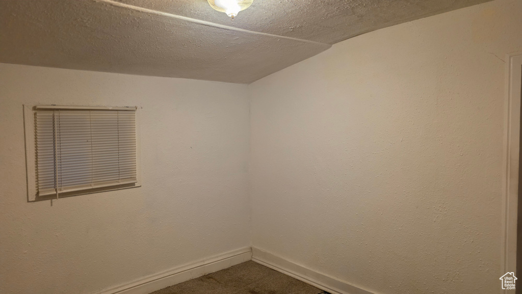 Empty room with baseboards and carpet floors