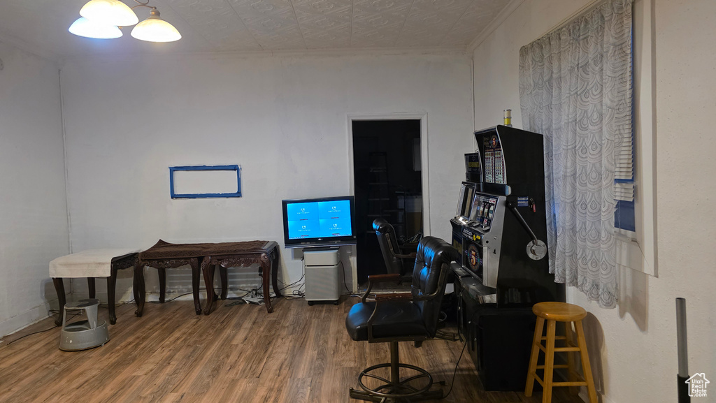 Game room with wood finished floors and an ornate ceiling