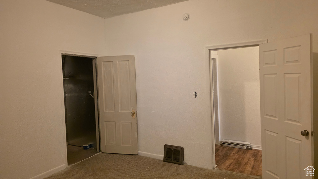 Unfurnished bedroom with carpet