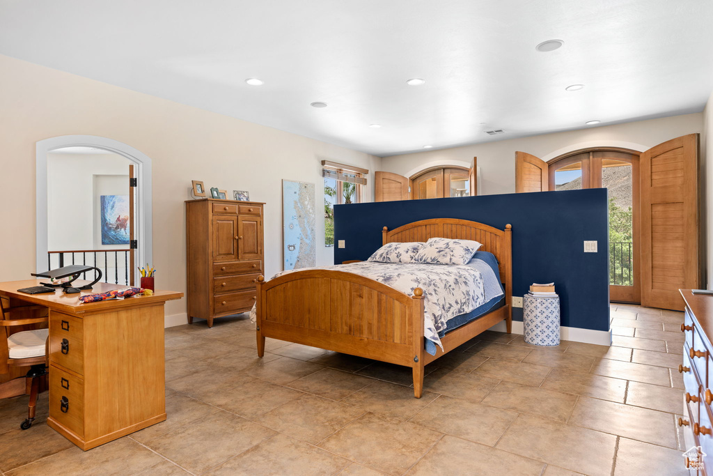 Bedroom featuring recessed lighting and access to outside