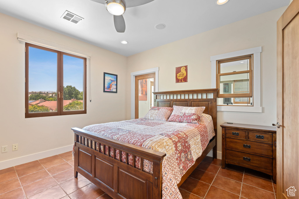 Tiled bedroom featuring recessed lighting and ceiling fan