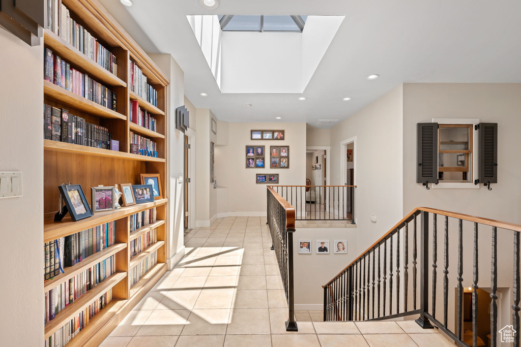 Hall featuring tile patterned flooring and recessed lighting
