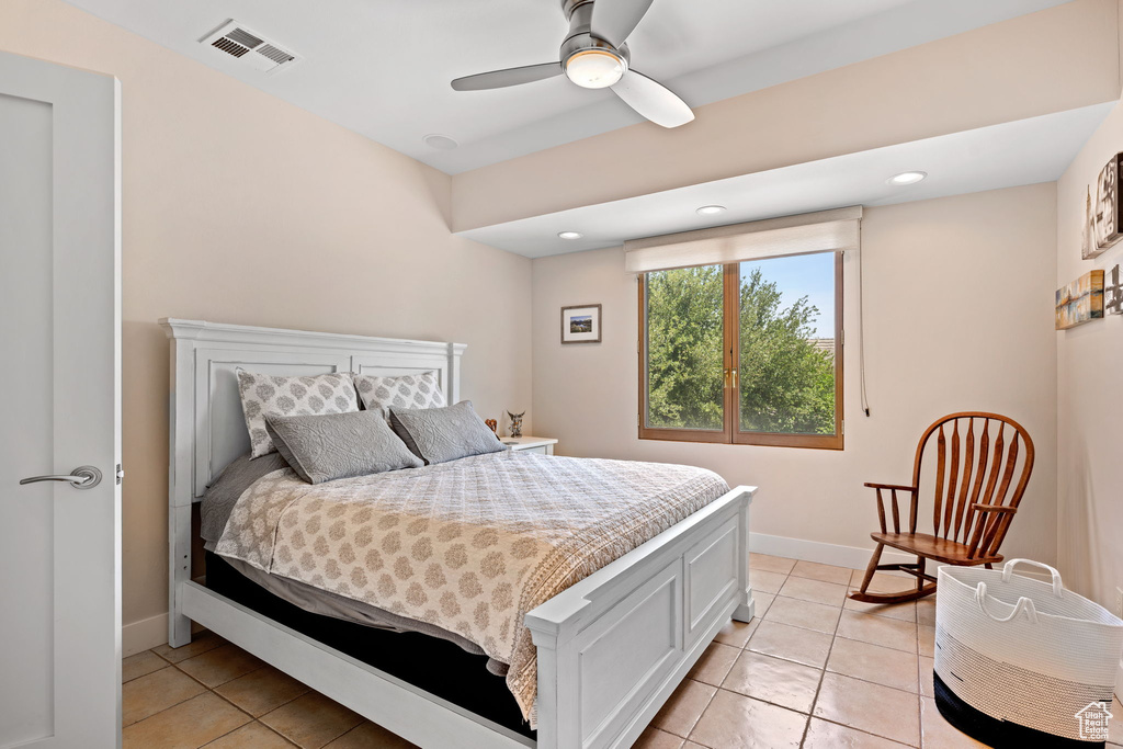 Bedroom featuring light tile patterned floors, recessed lighting, and a ceiling fan