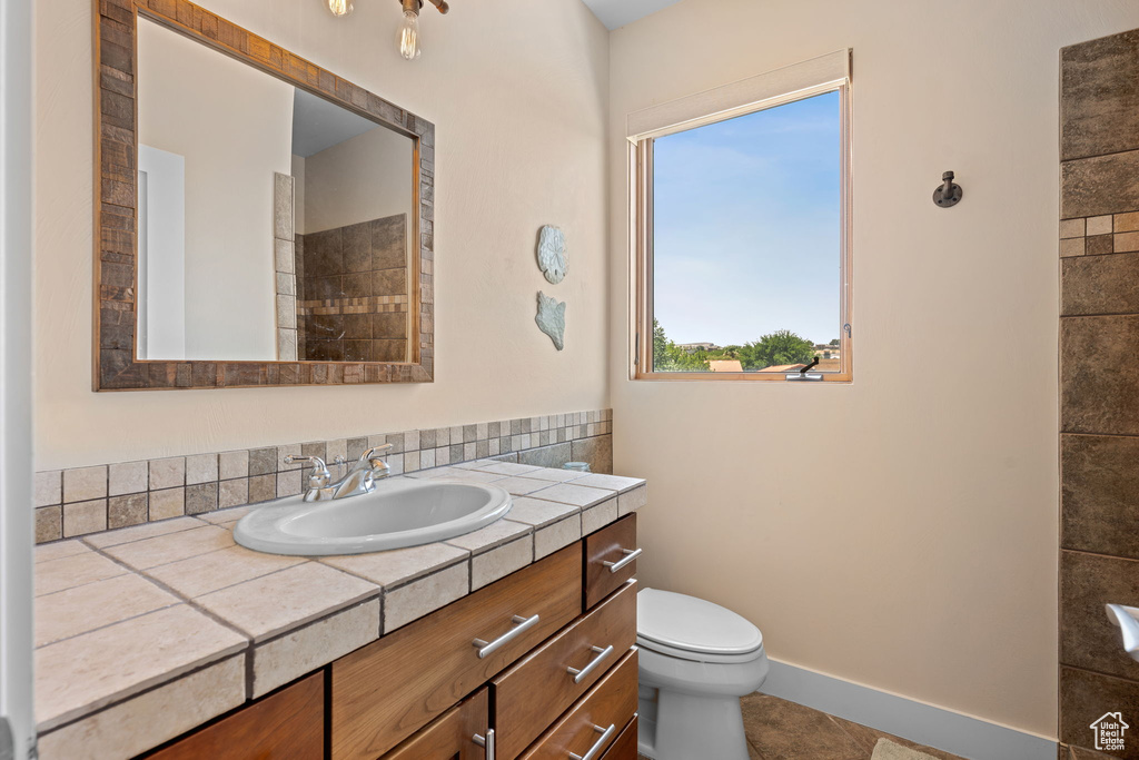Bathroom with vanity and tile patterned flooring